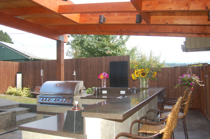 Eating bar with cooking equipment in background