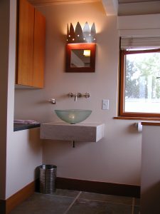 Unique light fixture above vessel sink