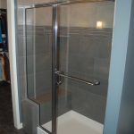 tiled shower, built-in bench, glass front and door