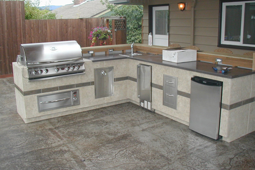 Outdoor kitchen addition, featuring stainless steel appliances, stamped concrete decking, Bellingham
